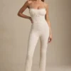 Arlena jumpsuit med blonder og sløyfe i elfenben