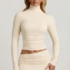 Auri Modal Ruched Backless Turtleneck Top i elfenben