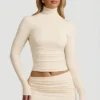 Auri Modal Ruched Backless Turtleneck Top i elfenben