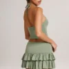 Azaria Modal Ruffle Mid-Rise Mini Skort i salviegrønn
