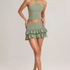 Azaria Modal Ruffle Mid-Rise Mini Skort i salviegrønn