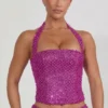 Caralie pyntet halterneck-korsett-top i magenta