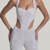 Coralena pyntet jumpsuit med utskjæringer i hvitt