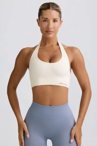 Define Luxe sports-BH med halterneck i hvit