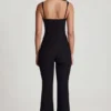 Elanie jumpsuit med rund hals, korsett og utvidede ben i svart