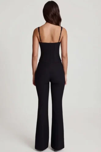 Elanie jumpsuit med rund hals, korsett og utvidede ben i svart