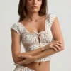 Faela Ruched Cotton-Poplin Corset Top i roseprint