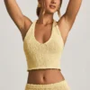 Gianna Bouclé halterneck-crop-top i gult