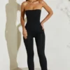 Jamila stroppeløs jumpsuit med utvidet kant i svart