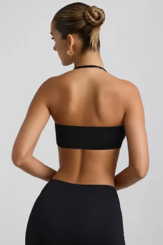 Jerika Slinky Jersey-bralette med metallbeslag og halterneck i svart