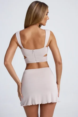 Kira Crop Top med utskjæringer og metallbeslag i skygrå