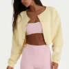 Kort cardigan i børstet jersey med knapper i myk gul