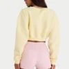 Kort cardigan i børstet jersey med knapper i myk gul