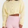 Kort cardigan i børstet jersey med knapper i myk gul
