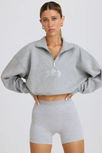 Kort sweatshirt med kvart glidelås i grå melert