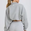 Kort sweatshirt med kvart glidelås i grå melert