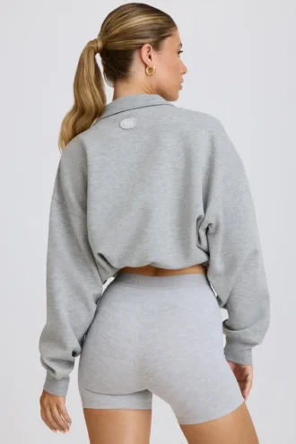 Kort sweatshirt med kvart glidelås i grå melert