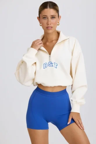 Kort sweatshirt med kvart glidelås i hvitt