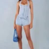 Lalita knappet playsuit med halterneck i lys denim