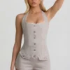 Lalita-playsuit med knappestolpe og halterneck i ecru