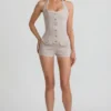 Lalita-playsuit med knappestolpe og halterneck i ecru