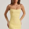 Lunetta pyntet bodycon-minikjole med rund hals i gult
