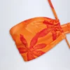 Maranta halterneck-badedrakt med utskjæringer i oransje orkide-mønster