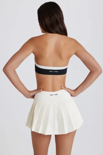 Myk, aktiv tennis-skort med lav midje og plissering i elfenben