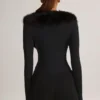 Nesta korsett-playsuit med fuskepelskant i svart