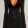 Nesta korsett-playsuit med fuskepelskant i svart