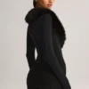 Nesta korsett-playsuit med fuskepelskant i svart
