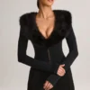 Nesta korsett-playsuit med fuskepelskant i svart