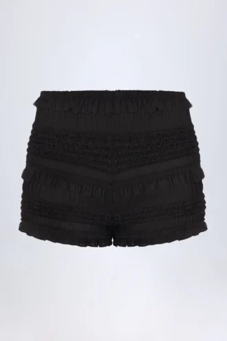 Orla shorts med volanger og middels høy midje i svart