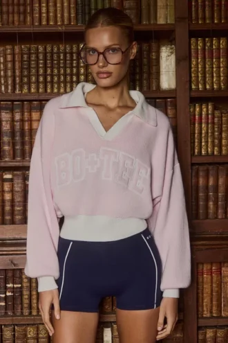 Oversized genser i bomullsjersey med V-hals i pudderrosa