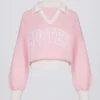 Oversized genser i bomullsjersey med V-hals i pudderrosa