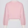 Oversized genser i bomullsjersey med V-hals i pudderrosa