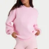 Oversized genser i ribbestrikk i blekrosa