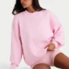 Oversized genser i ribbestrikk i blekrosa