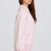 Oversized genser i rosa med jacquardmønster