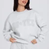 Oversized genser med rund hals i grå melert
