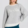 Oversized genser med strikket logo i Ice