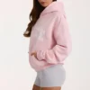 Oversized hettegenser med applikasjon i Blush