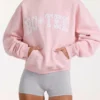 Oversized hettegenser med applikasjon i Blush