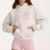 Oversized hettegenser med applikasjon i elfenben