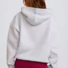 Oversized hettegenser med applikasjon i grått