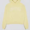 Oversized hettegenser med broderi i myk gul