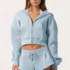 Oversized hettegenser med glidelås  i Powder Blue