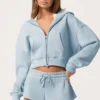 Oversized hettegenser med glidelås  i Powder Blue