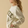 Oversized sweatshirt med rund hals i benhvit