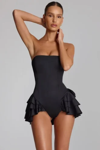 Priaska korsett-playsuit med volanger og snøring i svart
